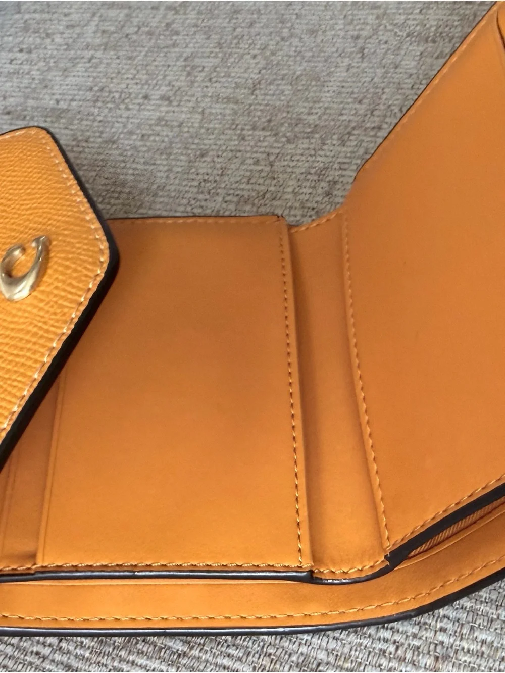 Coach Orange Leather Compact Wallet with Gold 'C' Hardware
